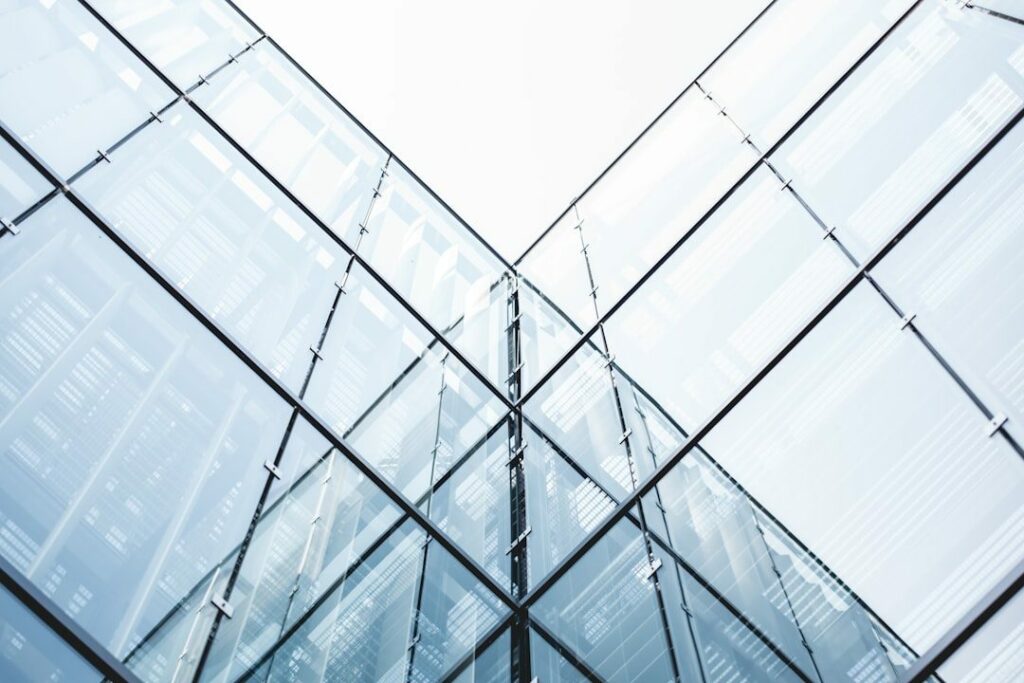 cropped curtain wall building under white sky nhdtxausbm8.jpeg